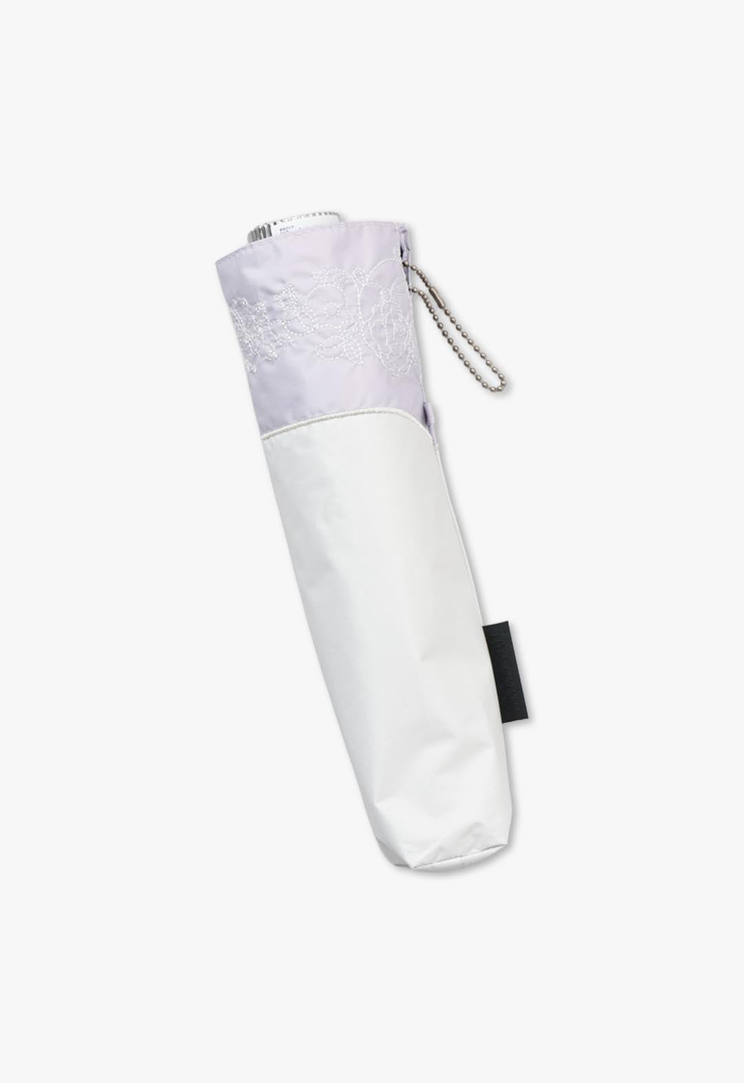 Cut-and-sew embroidered folding umbrella for all weather use