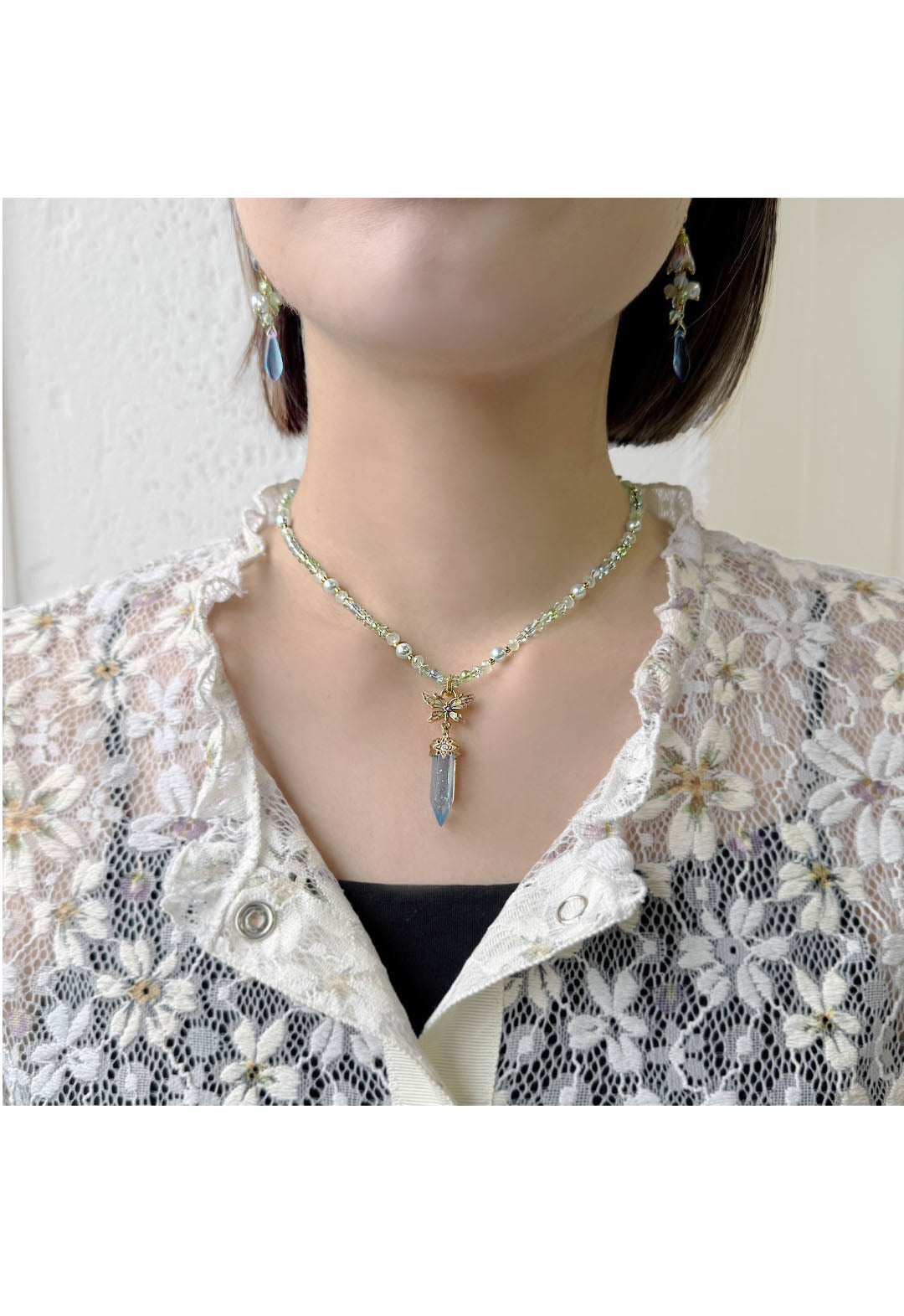 Butterfly and crystal motif necklace
