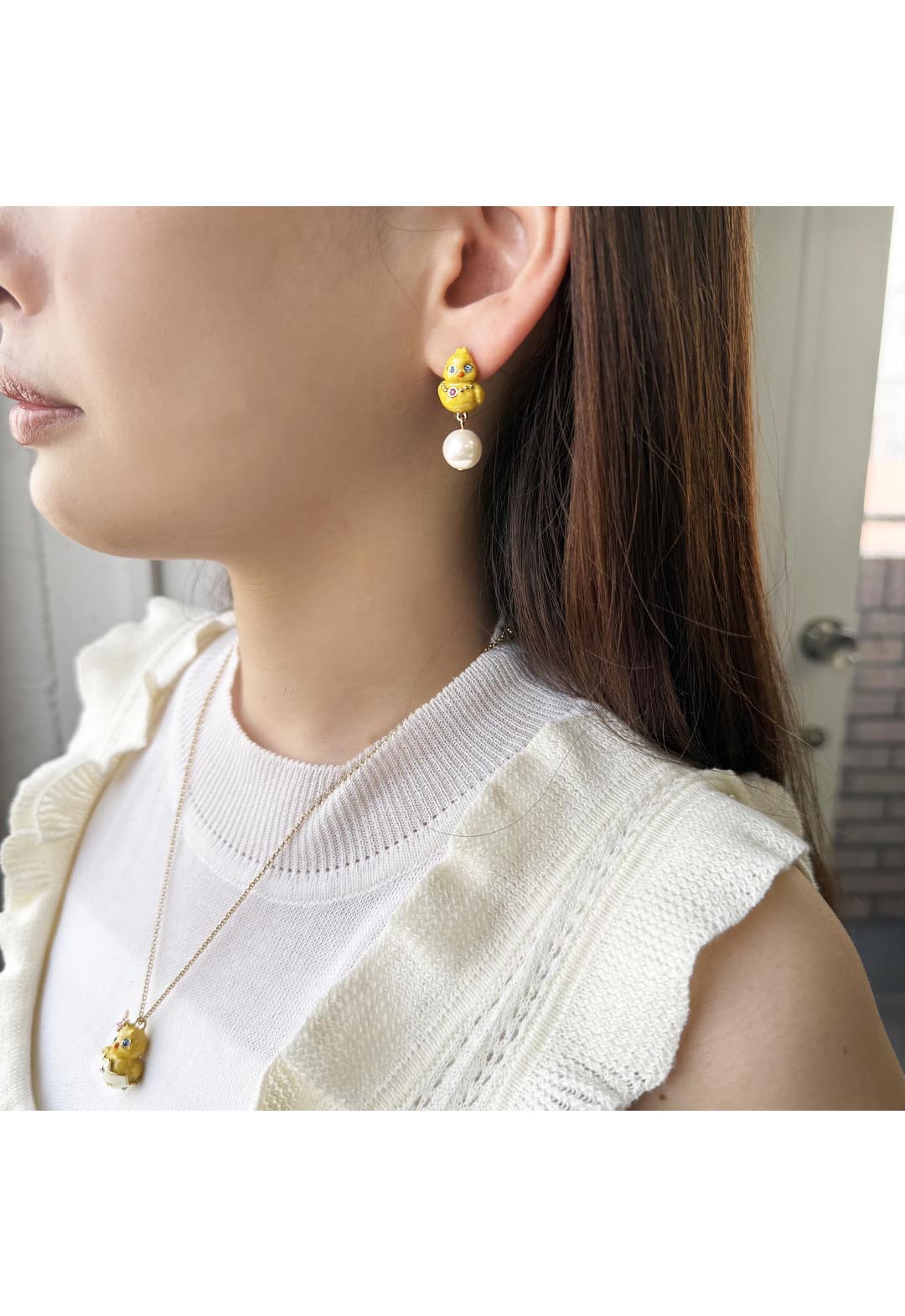 Chick motif earrings