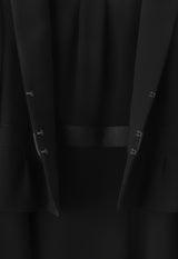 Black formal ensemble with no collar and waist tuck